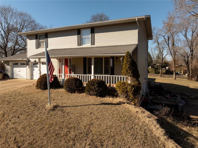 front of property with a porch and a garage