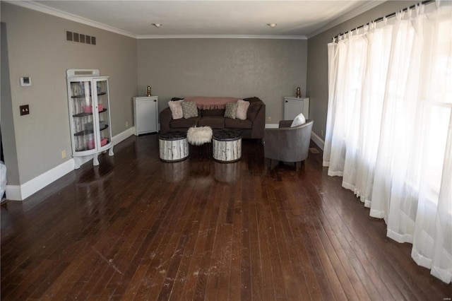 living room with dark hardwood / wood-style floors and ornamental molding