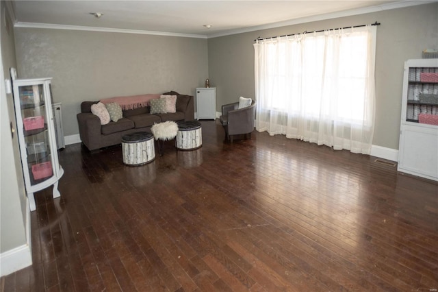 living room featuring dark hardwood / wood-style floors and crown molding