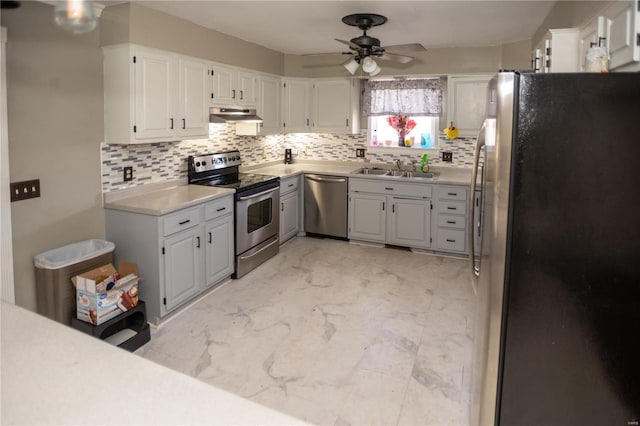 kitchen with ceiling fan, stainless steel appliances, white cabinetry, and light tile floors