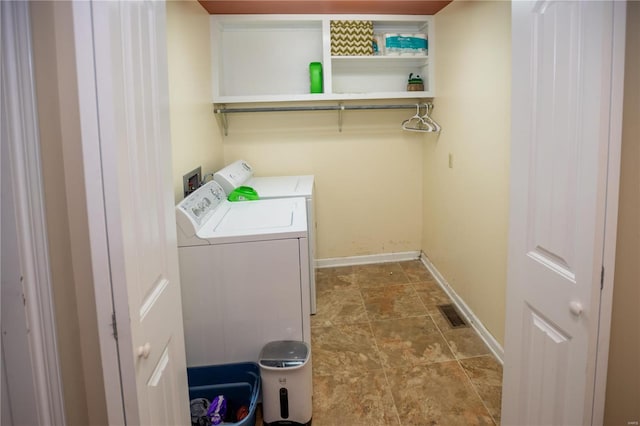 laundry room with washer hookup, light tile flooring, and separate washer and dryer