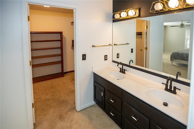 bathroom featuring dual vanity and ceiling fan