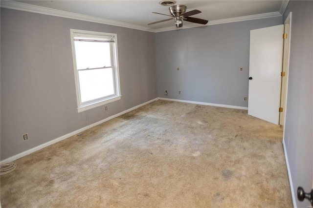 empty room featuring light carpet, ceiling fan, and ornamental molding