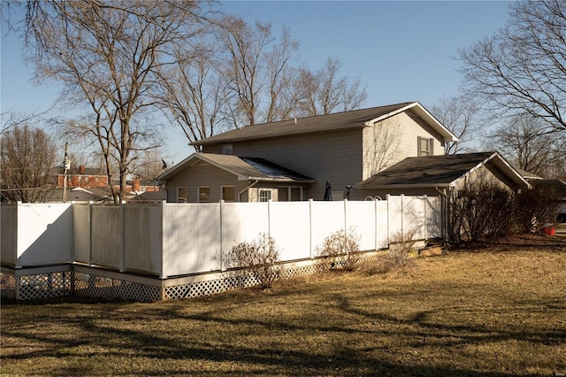 view of property exterior with a lawn