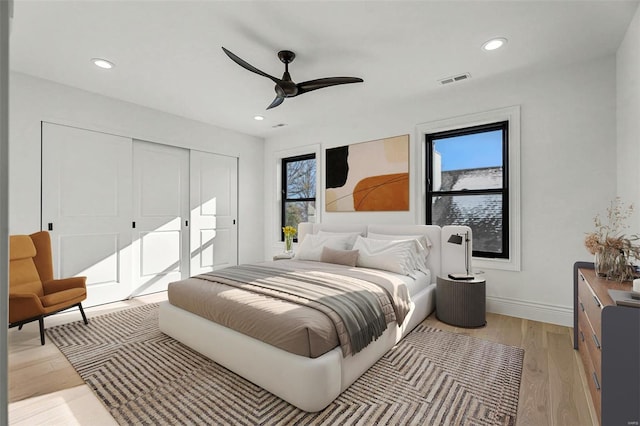 bedroom featuring access to outside, ceiling fan, and light hardwood / wood-style flooring