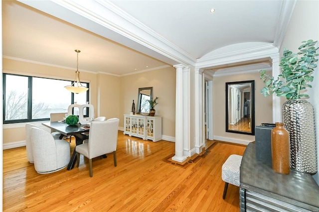 interior space with light wood-type flooring, ornate columns, and crown molding