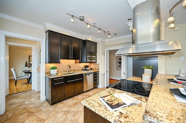 kitchen with island exhaust hood, light stone countertops, ornamental molding, stainless steel appliances, and sink