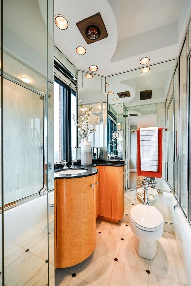 full bathroom with tile patterned flooring, vanity, toilet, and bath / shower combo with glass door