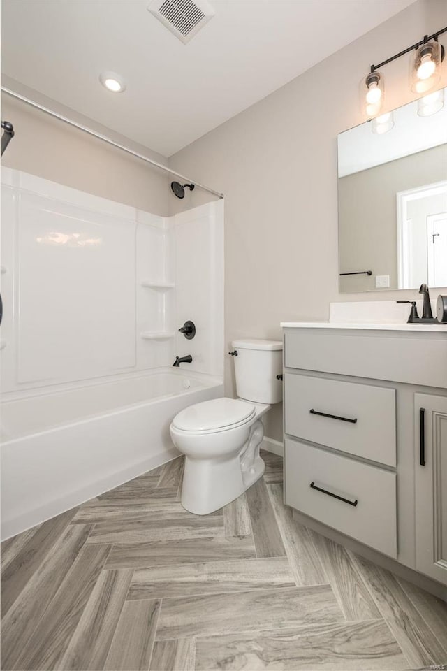 full bath featuring visible vents, toilet, vanity, and shower / tub combination