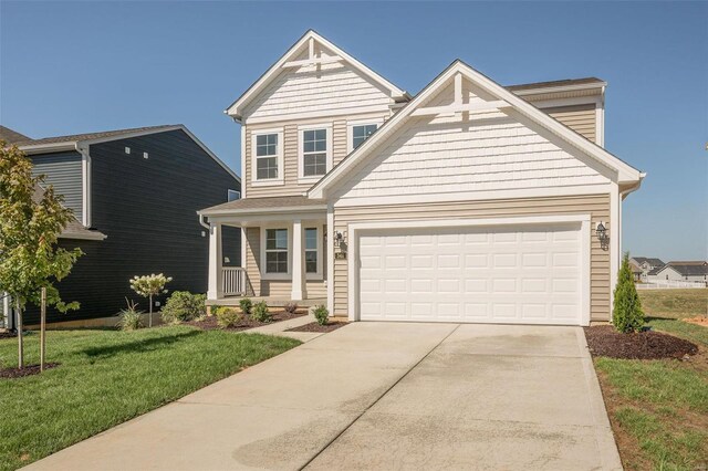 craftsman inspired home with driveway, an attached garage, and a front yard