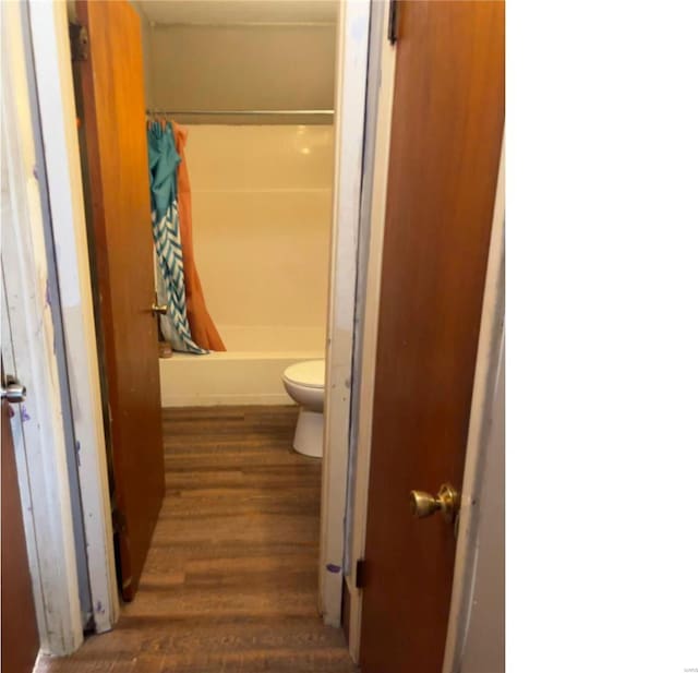 bathroom featuring toilet and hardwood / wood-style floors