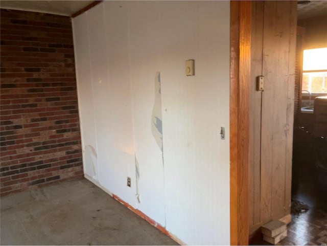 hallway with brick wall