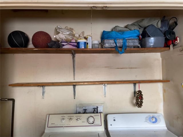 laundry room featuring washer hookup and washing machine and clothes dryer