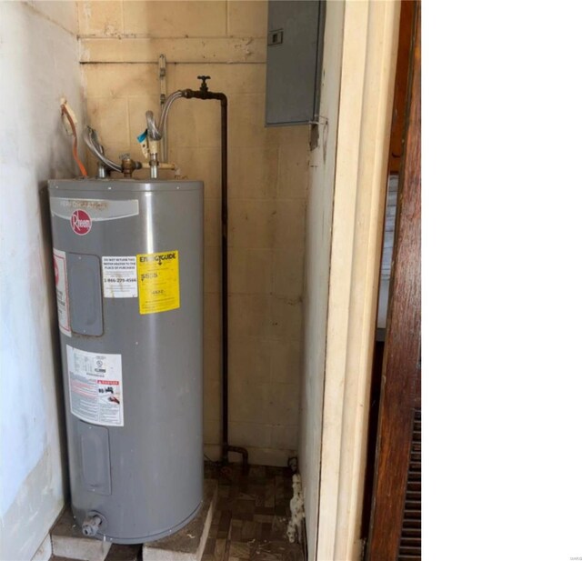 utility room with electric water heater