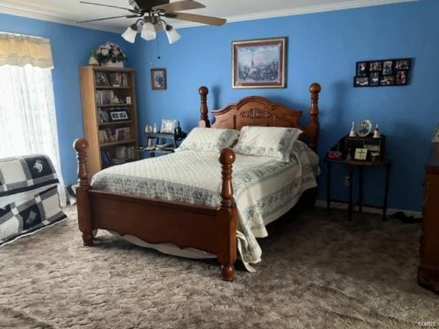 carpeted bedroom featuring ornamental molding and ceiling fan