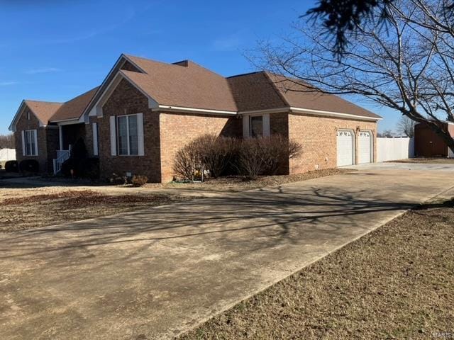 view of side of home with a garage