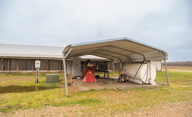 exterior space with a lawn and a carport