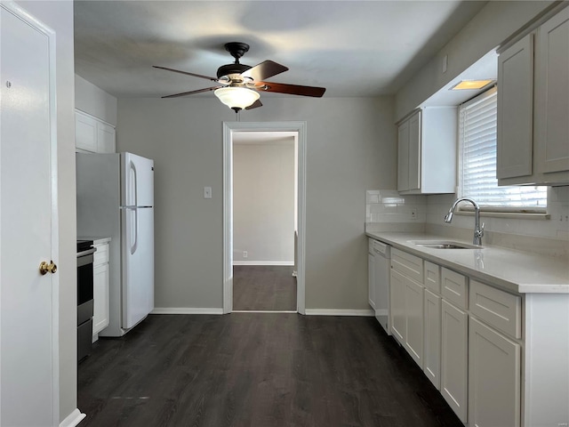 kitchen featuring white cabinets, ceiling fan, white appliances, and dark hardwood / wood-style floors