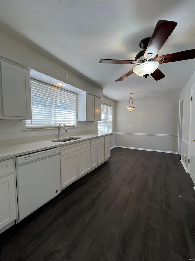 kitchen with dark hardwood / wood-style floors, dishwasher, sink, and white cabinets