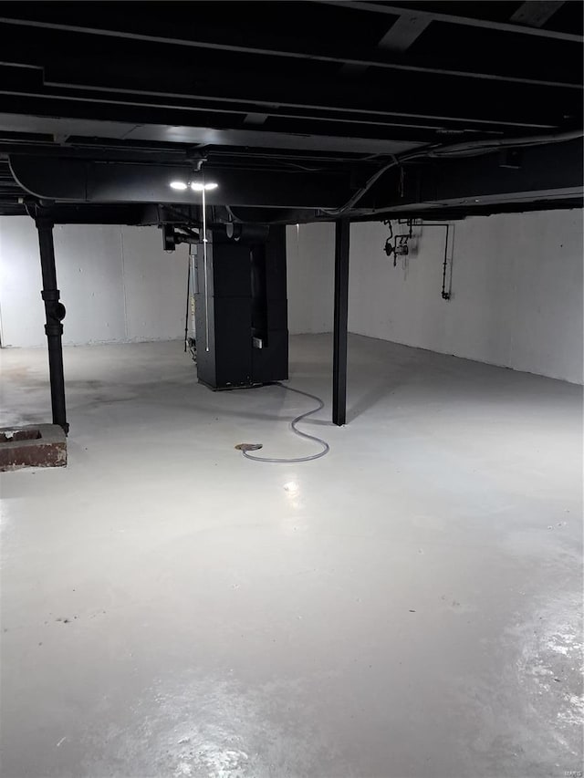 basement featuring heating unit