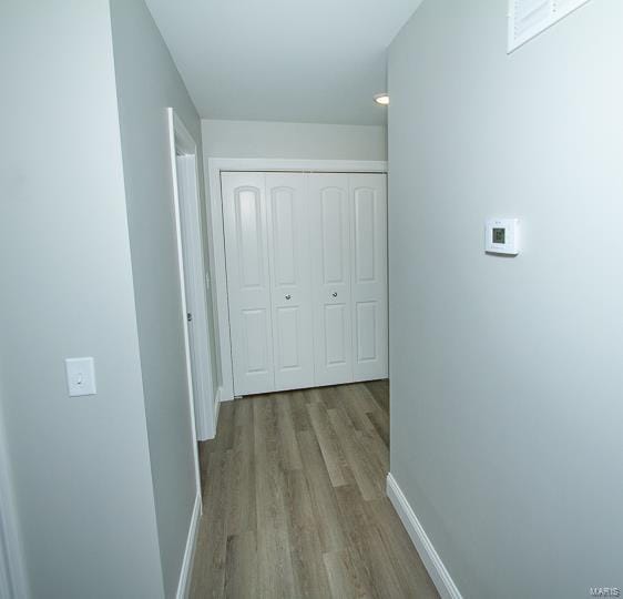 hall with light hardwood / wood-style floors