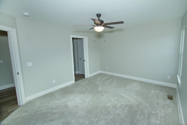 unfurnished bedroom with carpet floors and ceiling fan