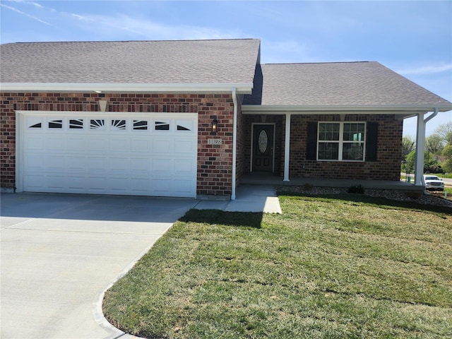 single story home featuring a front lawn, covered porch, and a garage