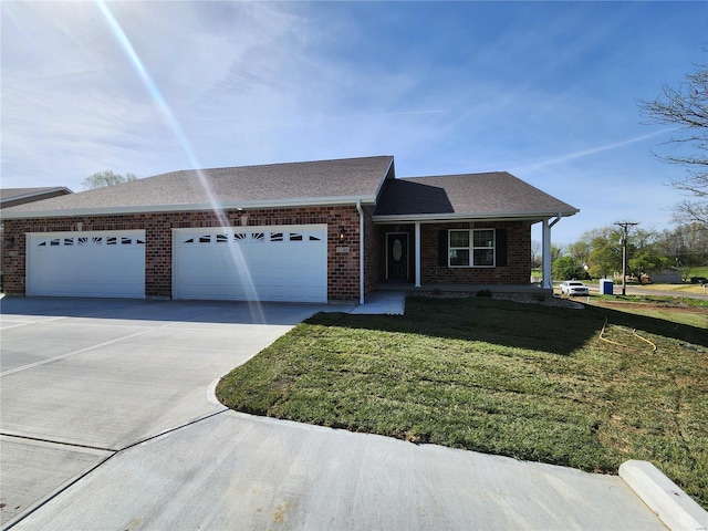 single story home with a front yard and a garage