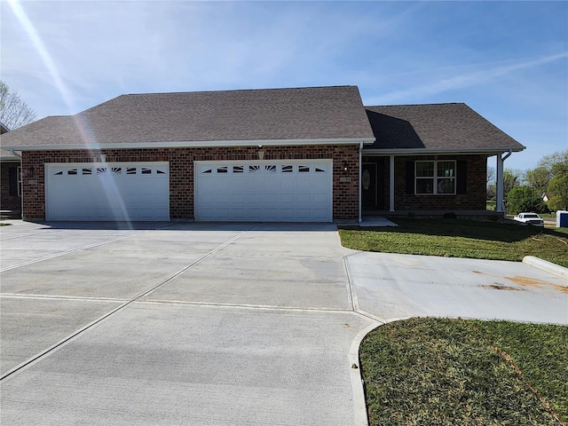 ranch-style house featuring a front yard and a garage