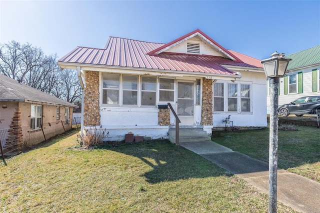 bungalow with a front lawn