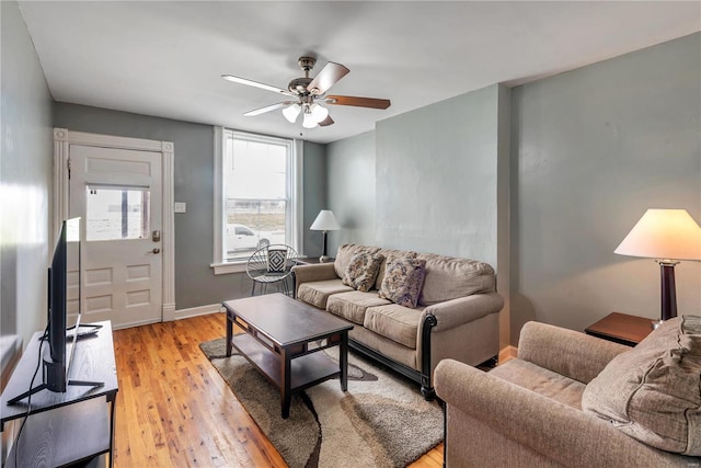 living room featuring ceiling fan and light wood-type flooring