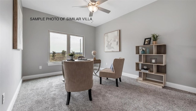 carpeted home office with ceiling fan and vaulted ceiling