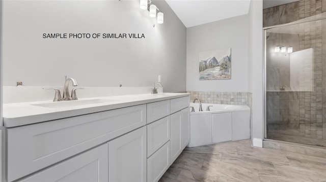 bathroom featuring tile flooring, independent shower and bath, and dual bowl vanity