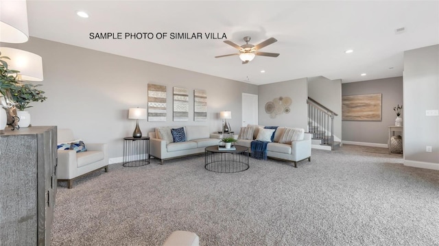 carpeted living room with ceiling fan