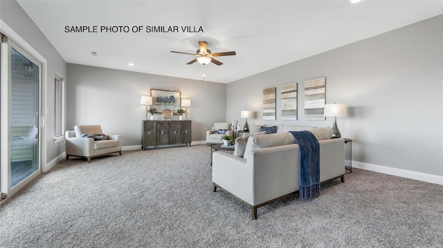 carpeted living room featuring ceiling fan