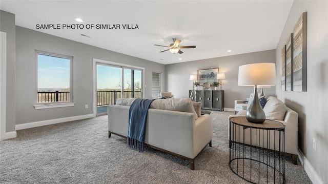 carpeted living room with ceiling fan