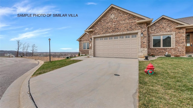 view of front facade with a front lawn and a garage