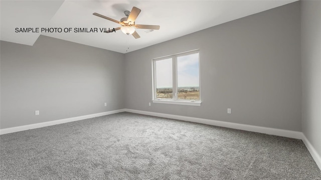 empty room with ceiling fan, lofted ceiling, and carpet