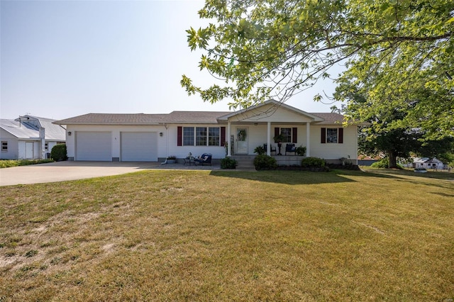 ranch-style house with covered porch, a front lawn, and a garage