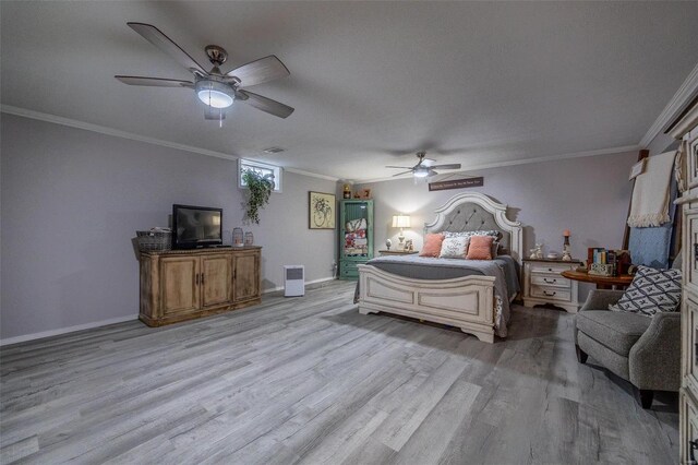 bedroom featuring ceiling fan, ornamental molding, and light hardwood / wood-style floors