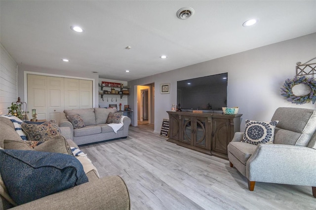 living room with light hardwood / wood-style floors