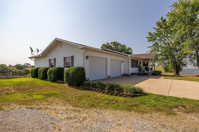 exterior space with a yard and a garage