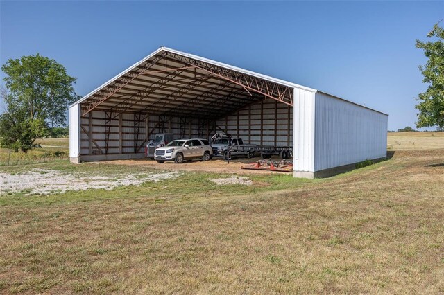 view of shed / structure featuring a carport and a yard