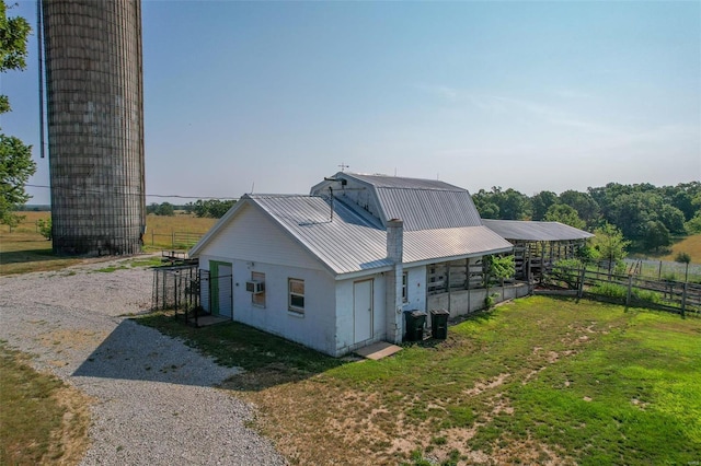 view of home's exterior featuring a lawn