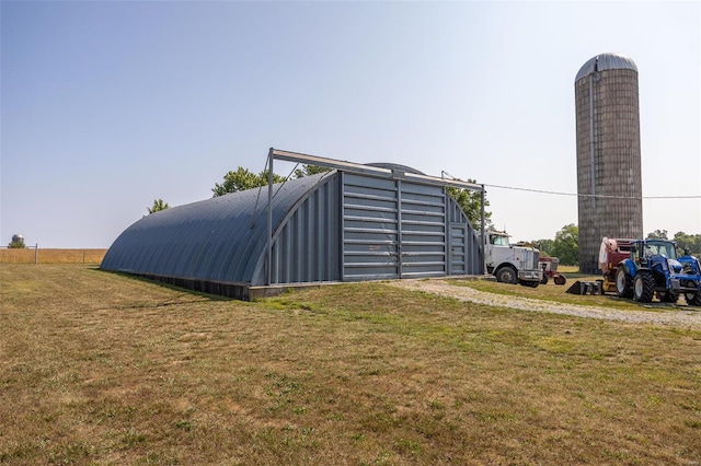 view of shed / structure with a lawn