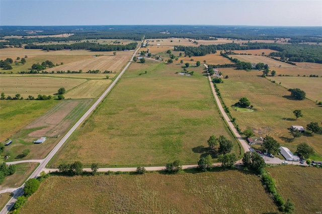 birds eye view of property with a rural view