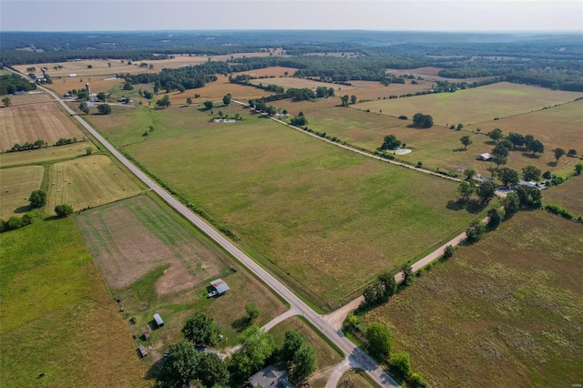 birds eye view of property with a rural view