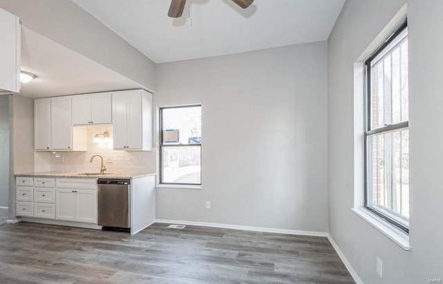 kitchen featuring ceiling fan, wood-type flooring, white cabinetry, and dishwasher