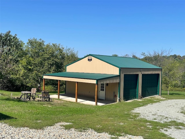 view of outdoor structure featuring a lawn