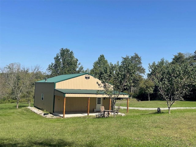 view of outdoor structure featuring a lawn